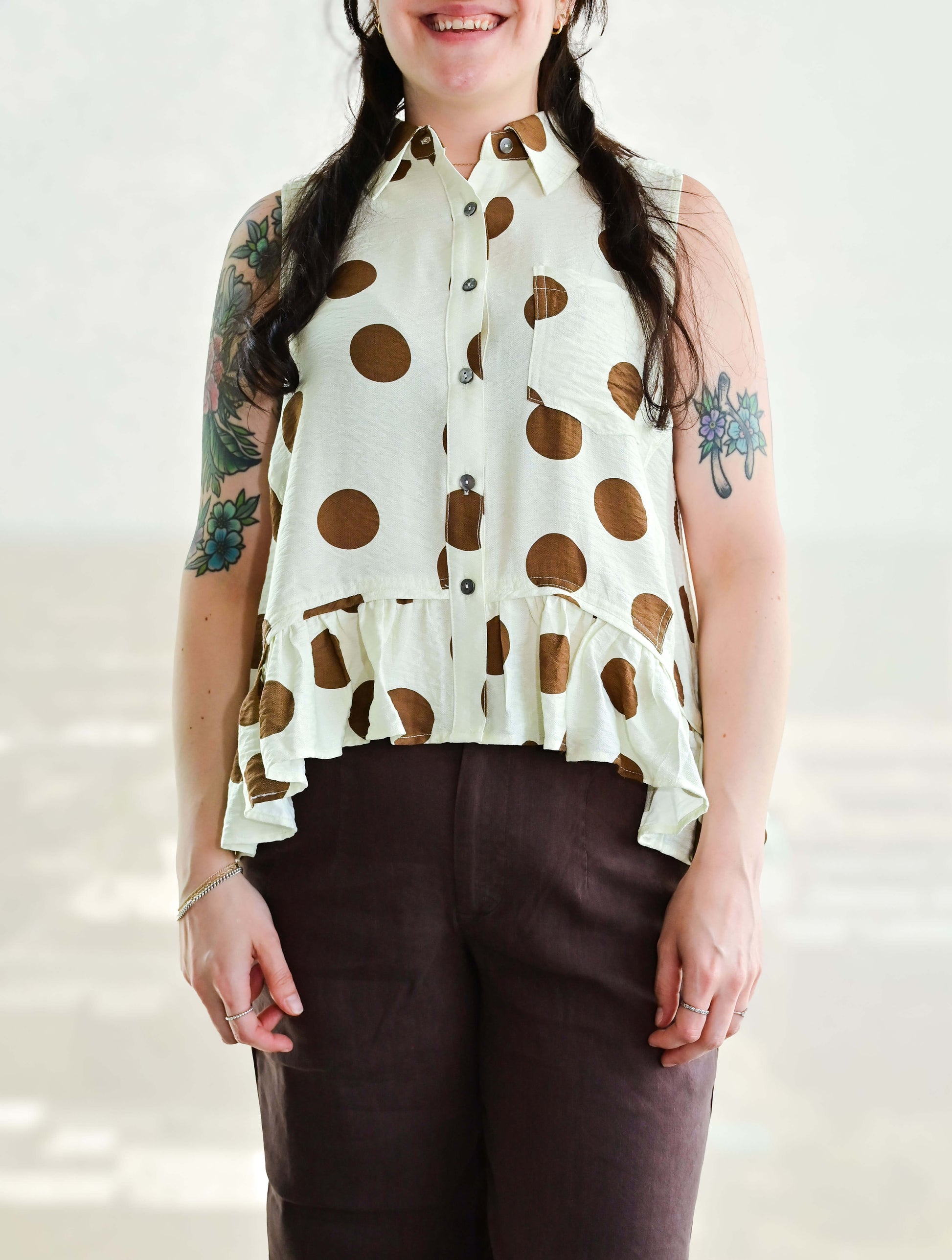 Polka Dot Sleeveless Button Up Blouse With Ruffle Hem