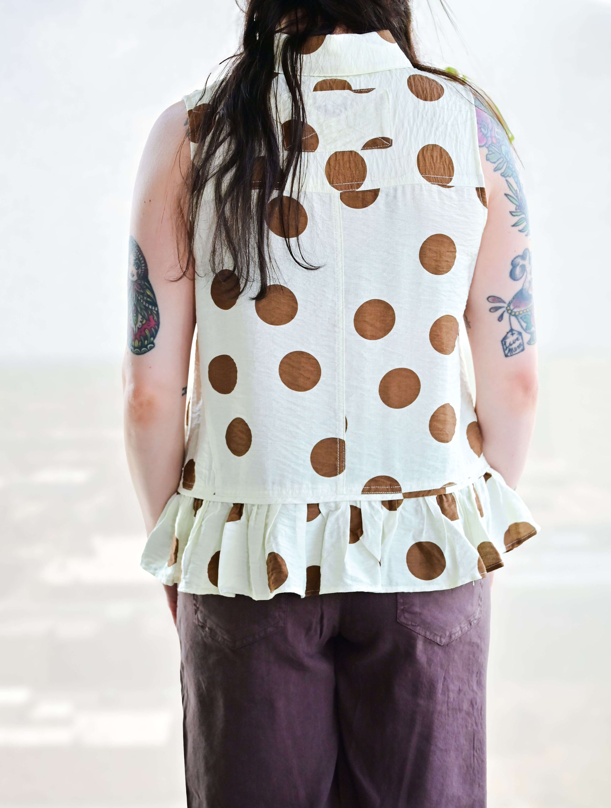 Polka Dot Sleeveless Button Up Blouse With Ruffle Hem