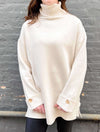 Turtleneck Tunic with Buttoned Cuff Detail in White