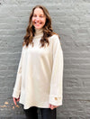 Turtleneck Tunic with Buttoned Cuff Detail in White