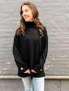 Turtleneck Tunic with Buttoned Cuff Detail in Black