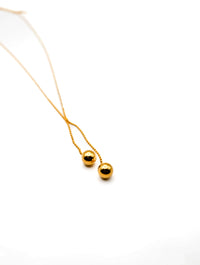 Dangling Spheres Necklace in Gold